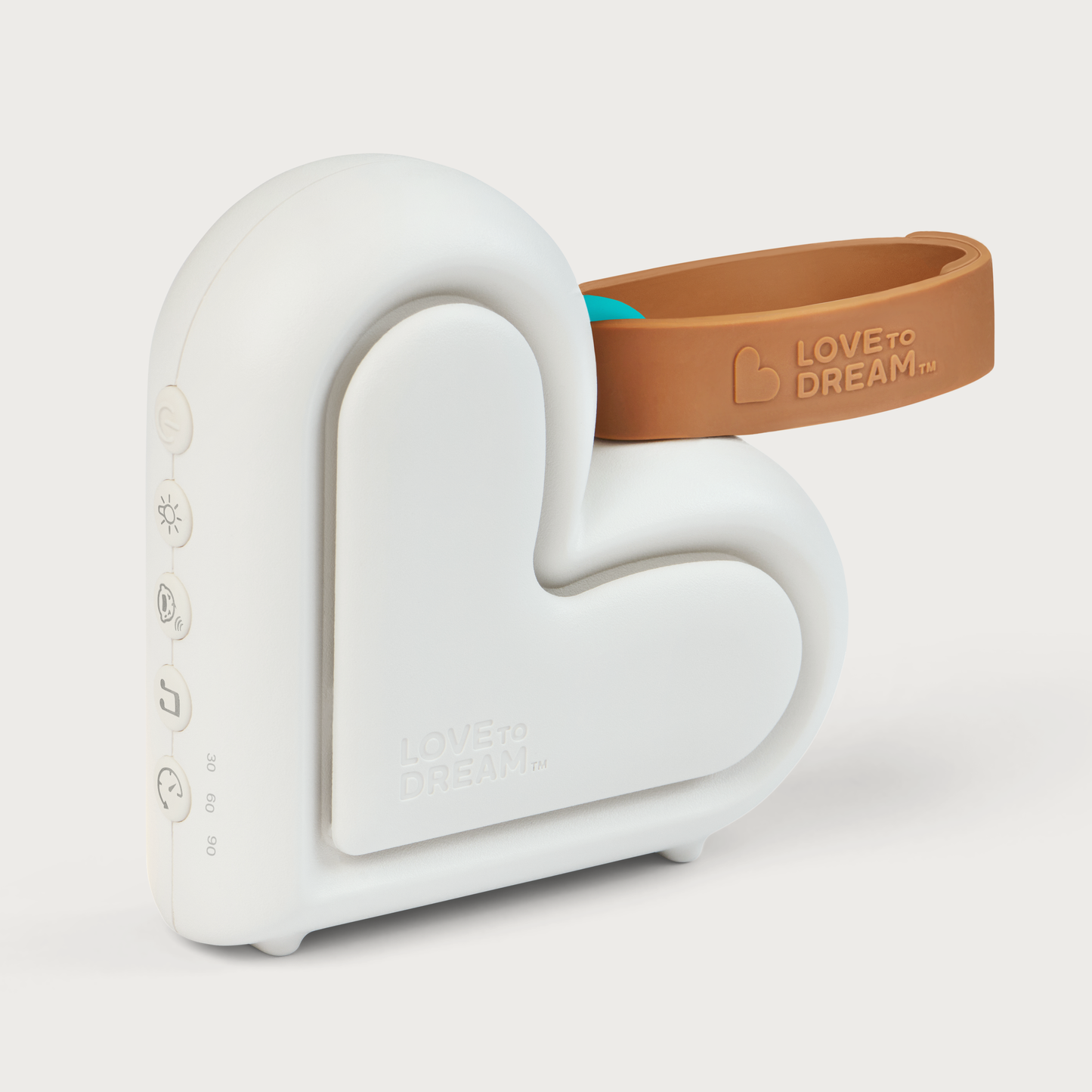 Love to Dream Sleep Machine, white heart-shaped portable sound machine with a tan carry strap.